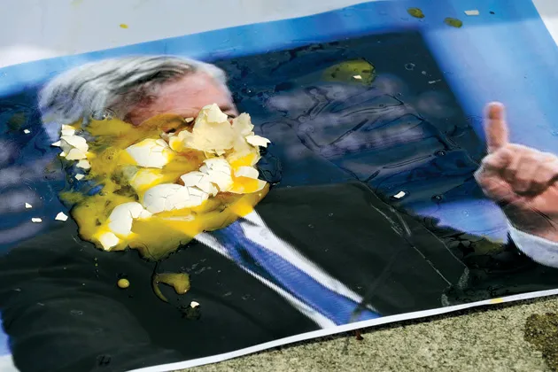 Demonstrators outside JPMorgan's annual meeting in Tampa put egg on Dimon's face
