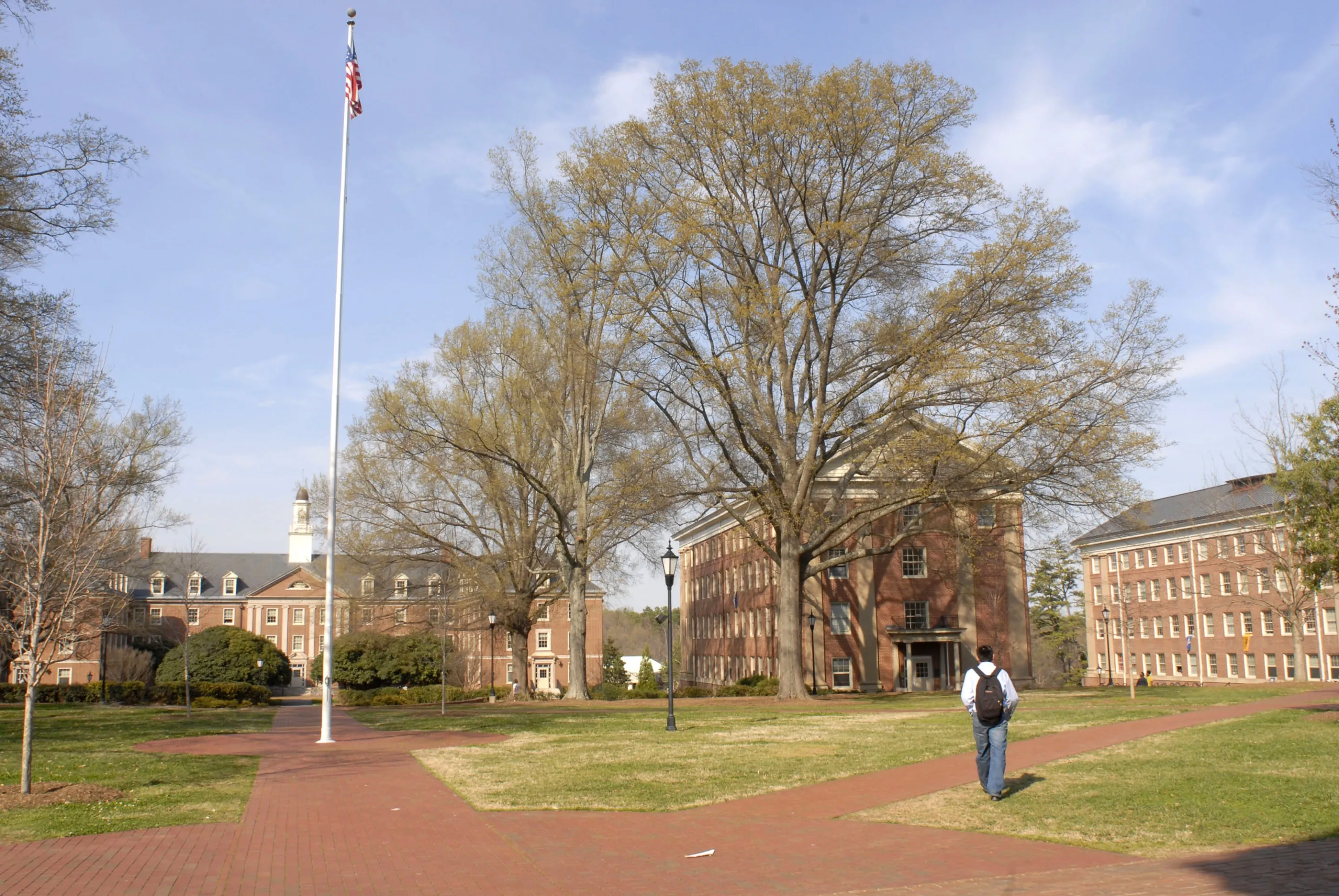 03/19/07 - DAVIDSON, NC.: Davidson College in Davidson, N.C., has announced it will be the first national liberal arts school to eliminate student loans. The school has said that instead of student loans, it will help with jobs and grants. A student walks across the Davidson College campus on Monday, March 19.
