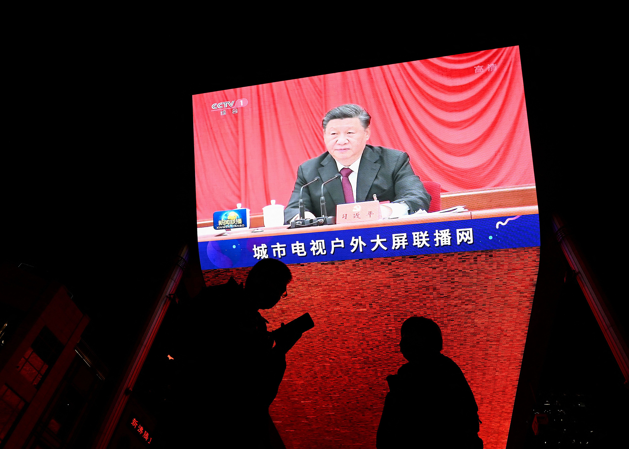 Xi Jinping on screen&nbsp;during an evening news program at a mall in Beijing.