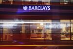 A bus passes a Barclays Bank Plc bank branch in London, U.K.
