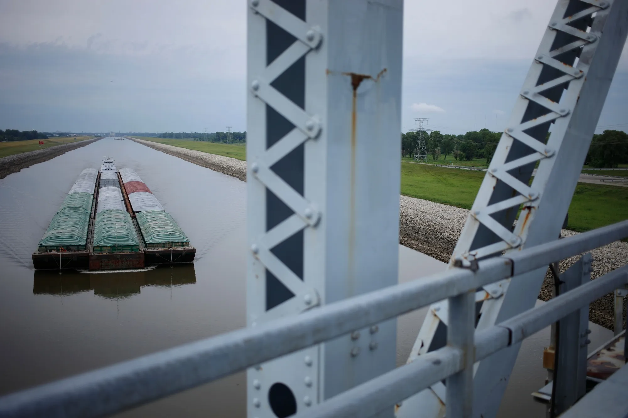 A towboat pushes barges up the Mississippi River in Granite City, Illinois.