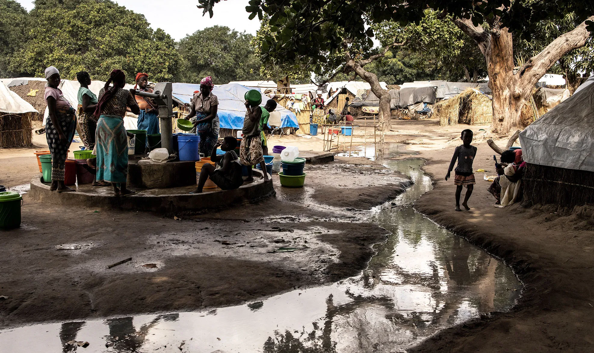 Women pump water&nbsp;at&nbsp;an&nbsp;internally displaced person camp in Metuge,&nbsp;Mozambique on May 20.