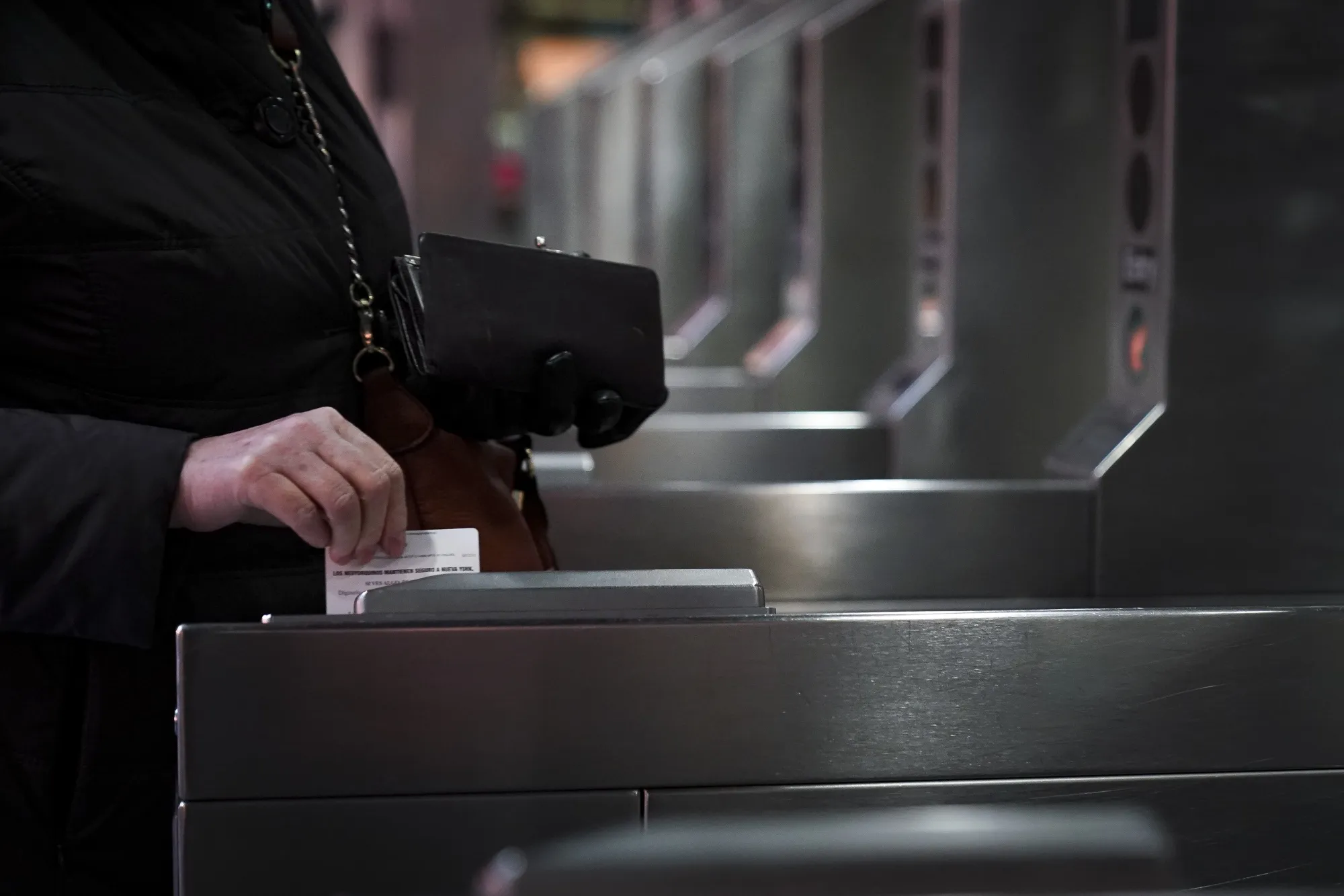 A rider&nbsp;swipes a MetroCard at the Fulton Center subway station in New York City. The familiar plastic cards will soon go the way of the token.&nbsp;