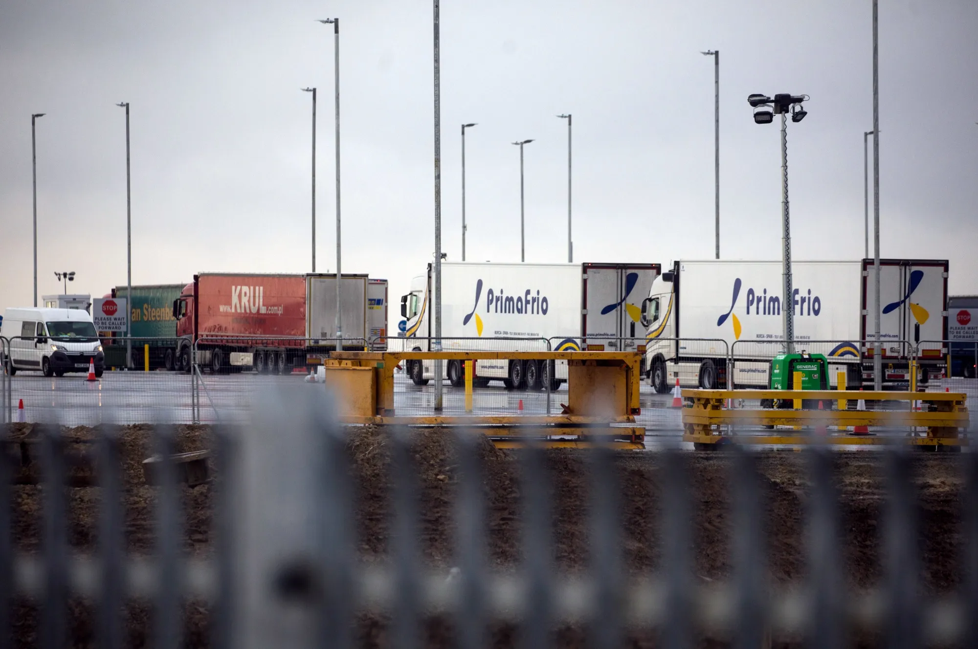 Trucks after entering the Sevington Inland Border facility for customs clearance near Mersham, U.K., on Tuesday, Jan. 5, 2021. The lack of chaos at Britain's key ports in the days following Brexit may be deceptive, truckers said, as businesses decided to stockpile or delay deliveries, leaving only minimal levels of traffic flowing.