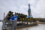 A worker inspects drilling pipes at a gas drilling rig on the Gazprom PJSC Chayandinskoye oil, gas and condensate field, a resource base for the Power of Siberia gas pipeline, in the Lensk district of the Sakha Republic, Russia, on Wednesday, Oct. 13, 2021. European natural gas futures declined after Russia signaled that it may offer additional volumes soon. Photographer: Andrey Rudakov/Bloomberg