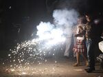 Children light firecrackers during Diwali Festival celebrations in New Delhi on Nov. 7.
