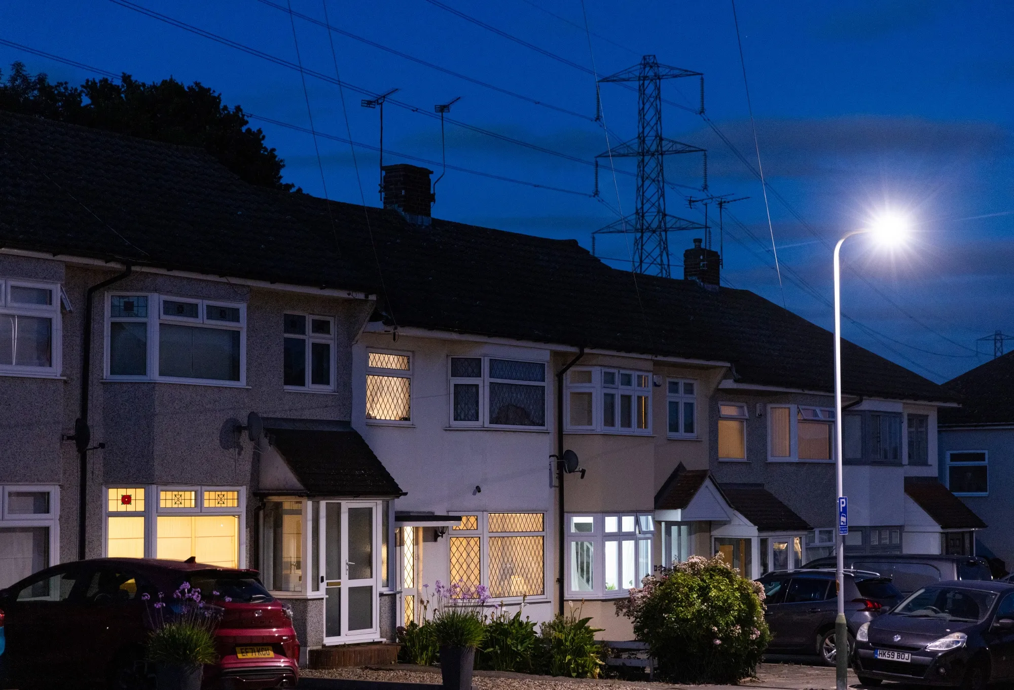 An electricity transmission tower near residential houses&nbsp;in Upminster, UK.
