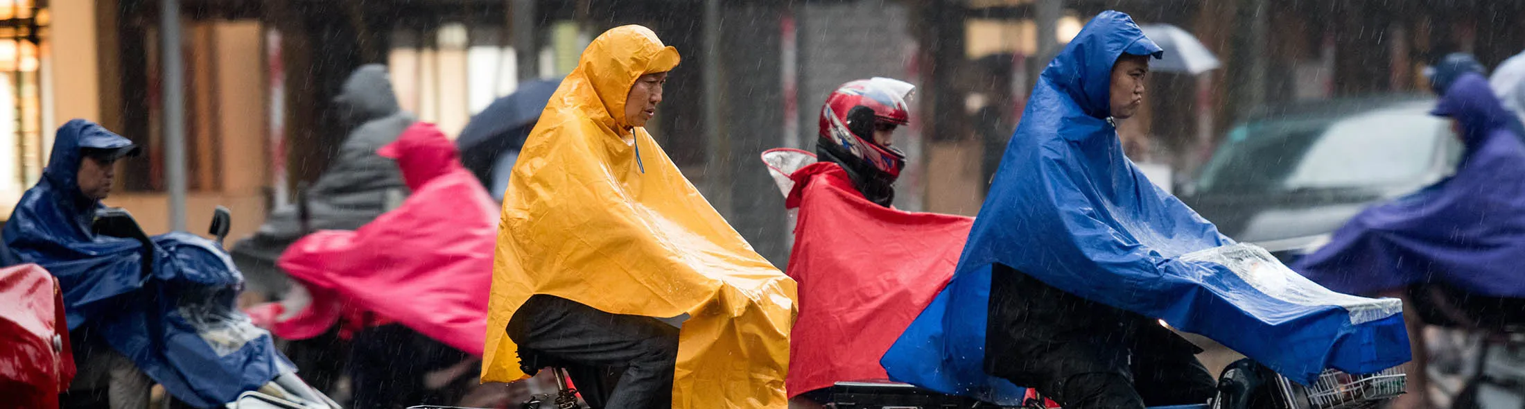 1484871210_china bicycle rain storm lede