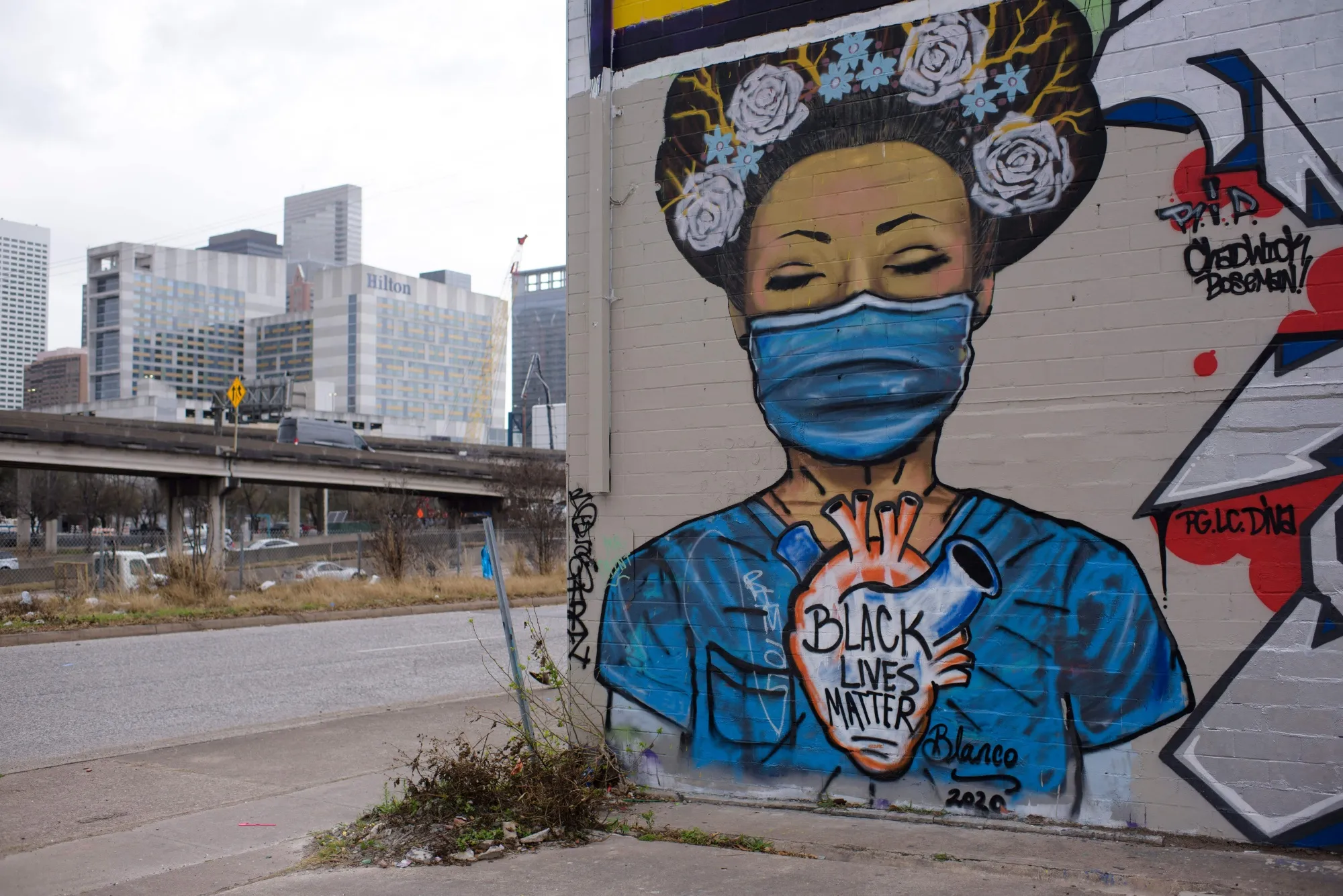 A mural overlooks part of the downtown skyline in Houston, Texas,&nbsp;on March 10, 2021. According to an Urban Institute simulation, the 2020 census undercounted the city’s residents by 1.38%.&nbsp;