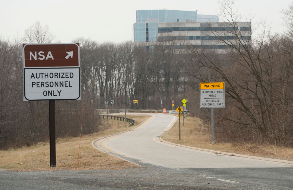 An entrance to the National Security Agency (NSA) headquarters is seen after a shooting incident at the visitor's entrance of the facility in Fort Meade, Maryland, February 14, 2018. Shots were fired early Wednesday at the ultra-secret National Security Agency, the US electronic spying agency outside Washington, leaving one person injured, officials said. Aerial footage of the scene from NBC News showed a black SUV with numerous bullet holes in its windshield crashed into concrete barriers at the main entrance to the NSA's headquarters in Fort Meade, Maryland. (Photo by SAUL LOEB / AFP) (Photo by SAUL LOEB/AFP via Getty Images) Photographer: SAUL LOEB/AFP