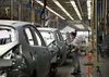 A worker assembles a vehicle on the production line at a plant operated by Dongfeng Peugeot-Citroen Automobile Ltd., the joint venture between Dongfeng Motor Corp. and PSA Peugeot Citroen, in Wuhan, China, on Wednesday, Oct. 16, 2013. PSA Peugeot Citroen is considering stake sales to Dongfeng Motor Corp. and the French government to shore up funding as car sales in Europe plunge to a 20-year low, people familiar with the matter said on Oct. 14.