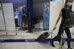 A traveler&nbsp;leaves&nbsp;a Covid-19 testing point inside Athens International Airport, in Athens, Greece, on Sept. 17.