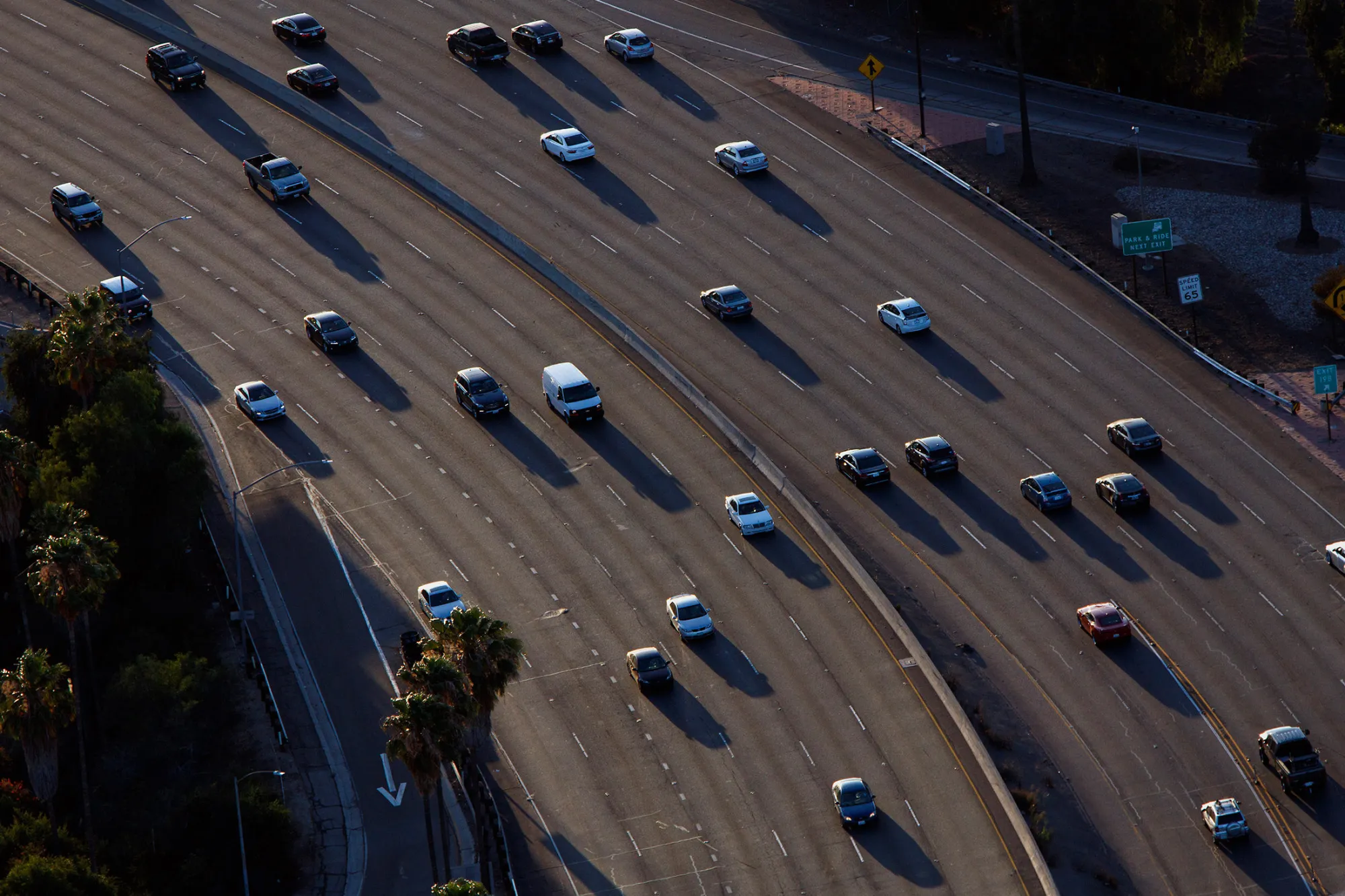 Vehicles move slowly in rush hour traffic on the US 101 freeway in this aerial photograph taken over the Sherman Oaks neighborhood of Los Angeles, California, U.S., on Friday, July 10, 2015.
