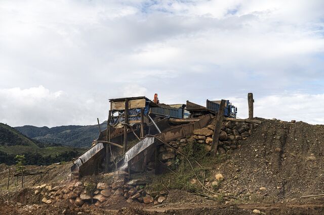 High-pressure water is used to break up riverbed materials and access gold deposits. 