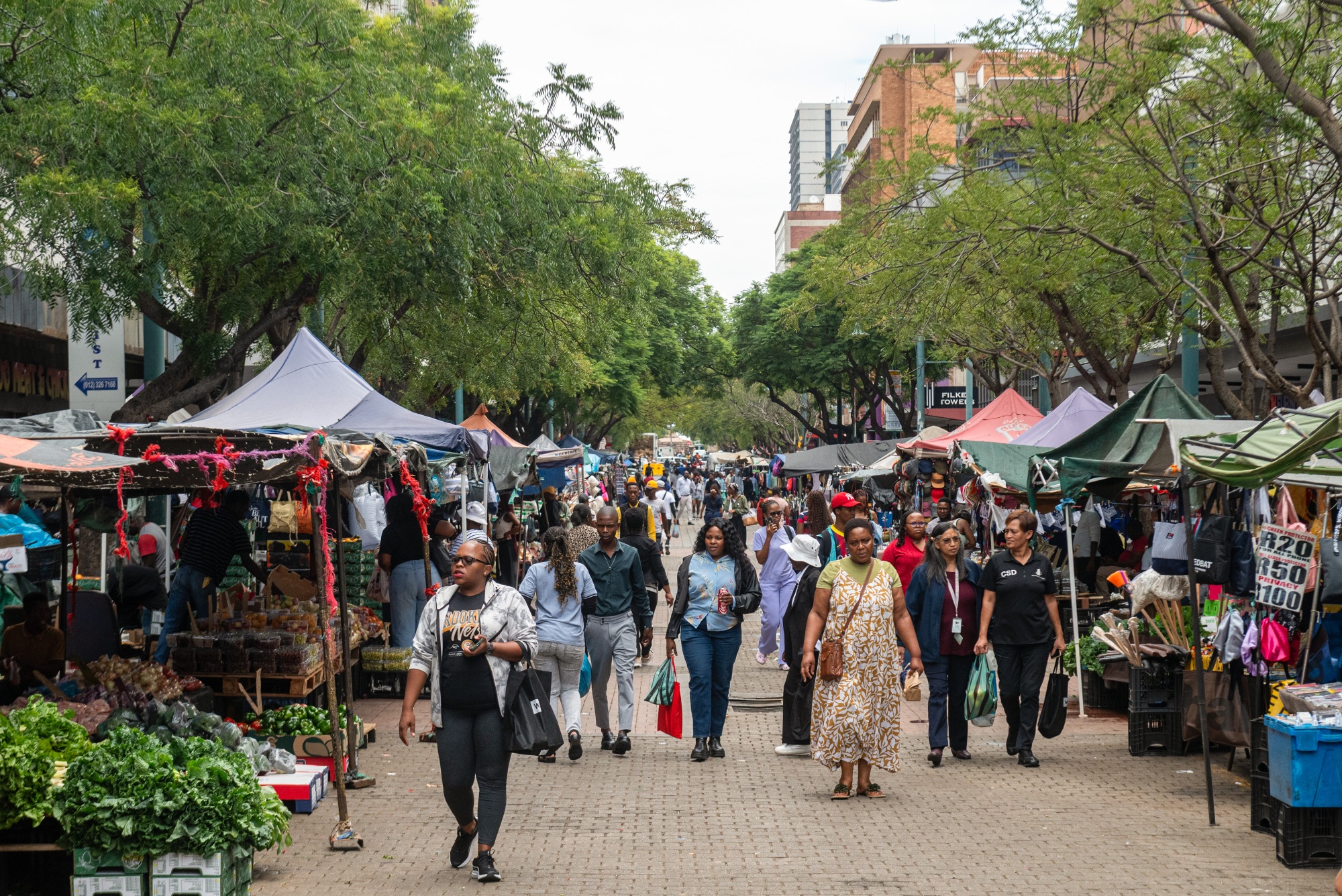 Shoppers at an outdoor market in the central business district in Pretoria, South Africa, on Wednesday, Feb. 18, 2026. South Africa’s unemployment rate dropped to the lowest level in more than five years in the fourth quarter, as the community and social services and construction sectors added workers.