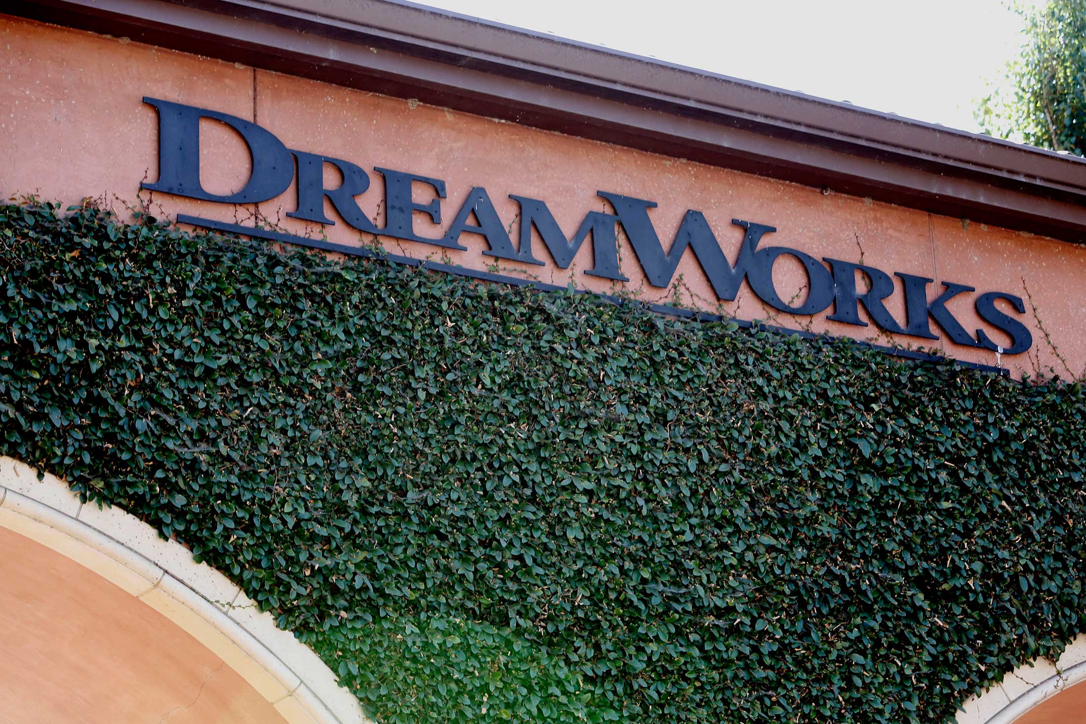 DreamWorks Animation SKG Inc. signage is displayed in the courtyard of the company's headquarters in Glendale, California, U.S., on Monday, July 15, 2013.
