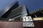A sign hung from Seattle City Hall after the Seattle City Council approved a $15 minimum wage 