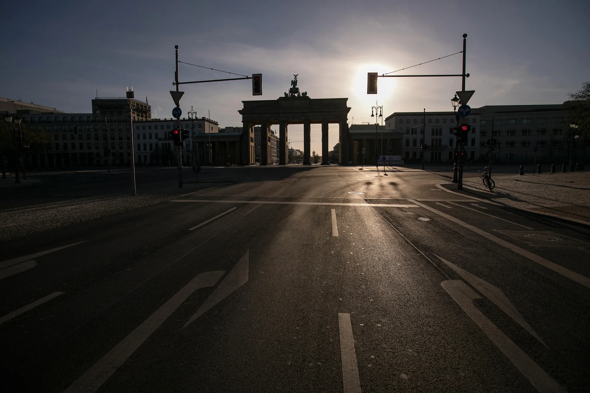 The Brandenburg Gate stands at the end of an empty street&nbsp;in Berlin on April 11.