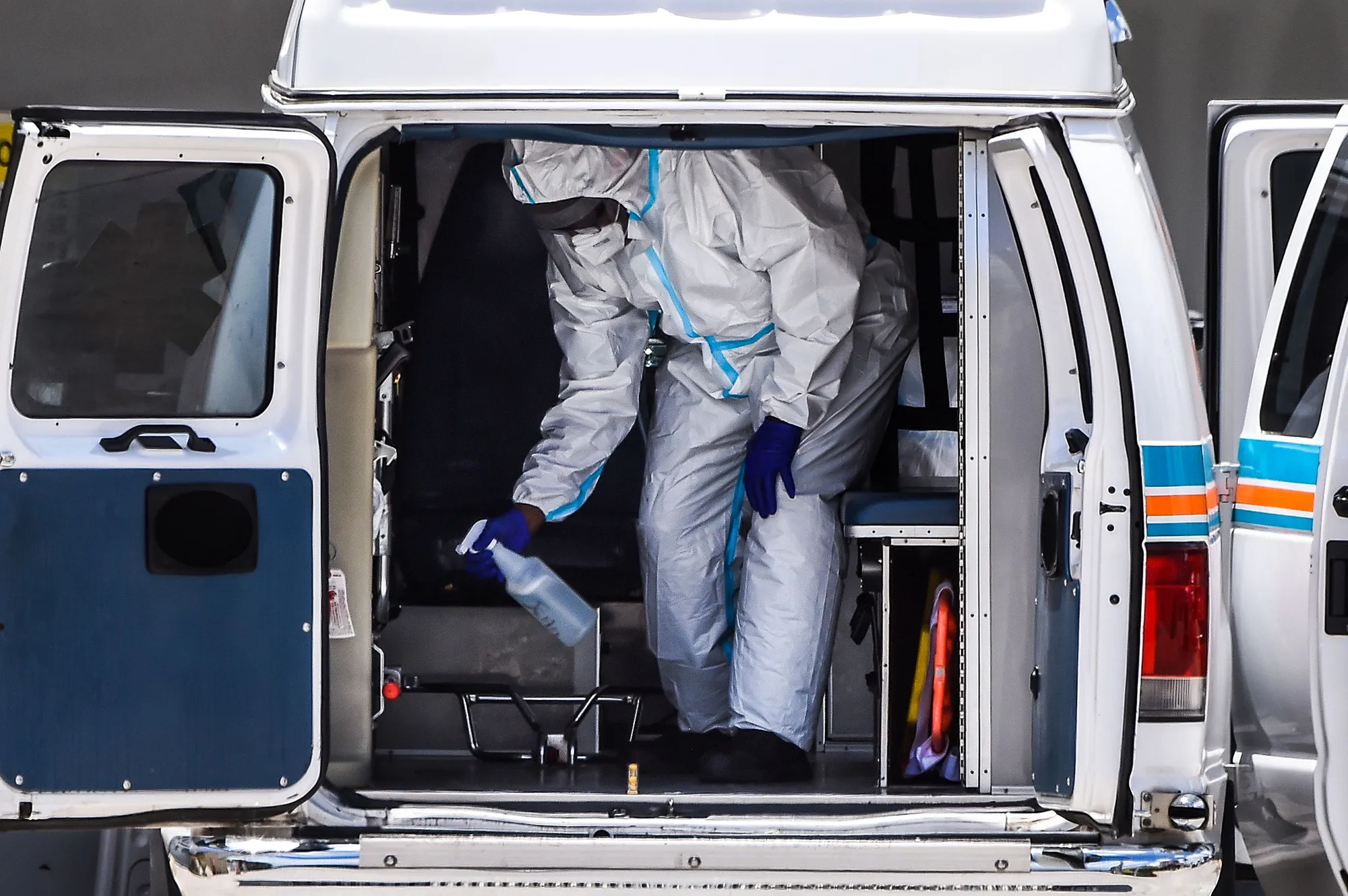 A medic sanitizes an&nbsp;ambulance outside&nbsp;Coral Gables Hospital in Florida, on July 30.