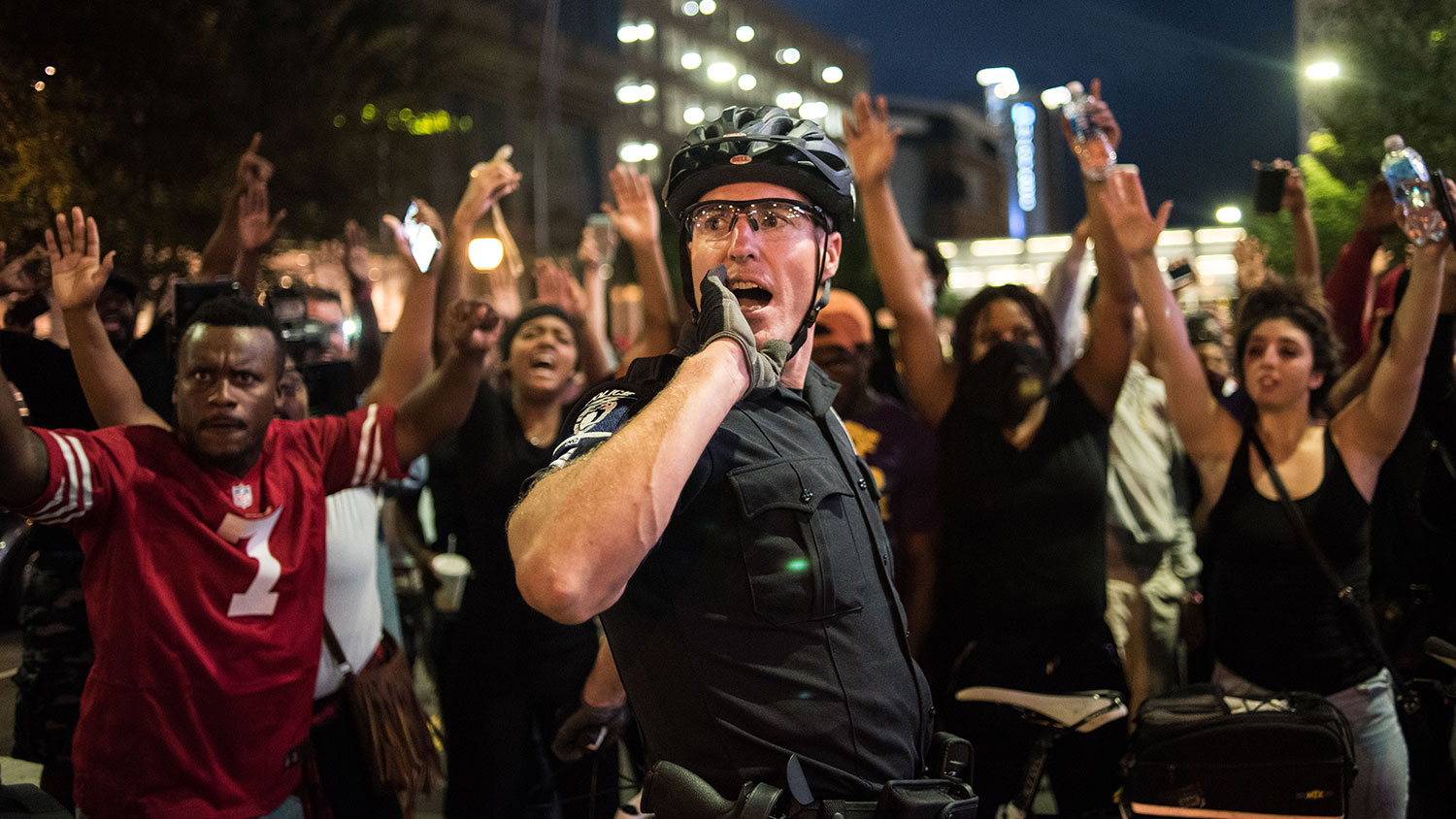A police officer communicates with other officers on Sept. 21, 2016, in Charlotte, North Carolina.
