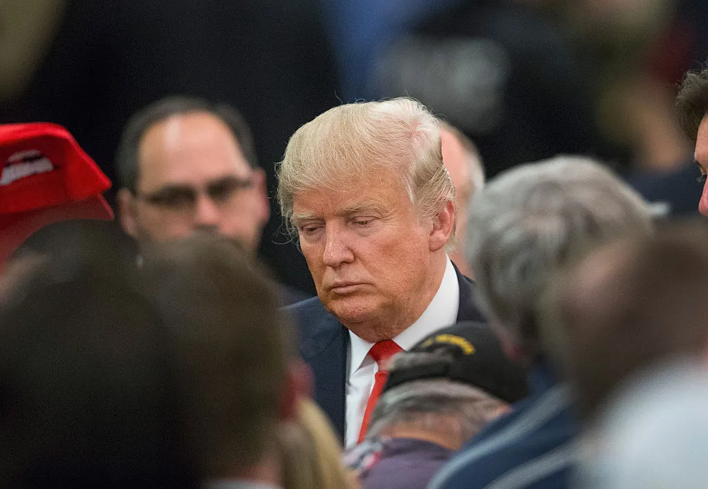 Republican presidential candidate Donald Trump greets guests following a campaign rally at the Radisson Paper Valley Hotel on March 30, 2016 in Appleton, Wisconsin.

