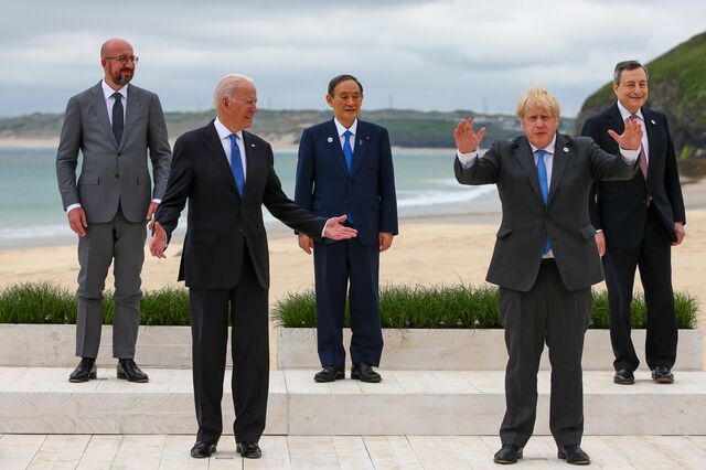 From left to right, Charles Michel, president of the European Council, U.S. President Joe Biden, Yoshihide Suga, Japan's prime minister, Boris Johnson, U.K. prime minister, Mario Draghi, Italy's prime minister, during the family photo on the first day of the Group of Seven leaders summit in Carbis Bay, U.K., on Friday, June 11, 2021. U.K. Prime Minister Boris Johnson will give leaders a beachside welcome, formally kicking off three days of summitry along the English coast after meeting U.S. President Joe Biden for the first time on Thursday.