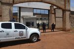 Police stand guard at Pedro Juan Caballero city jail entrance on Jan. 19 after dozens of inmates escaped