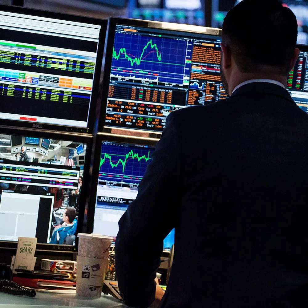 A trader works on the floor of the New York Stock Exchange (NYSE) in New York, U.S., on Friday, March 24, 2017. U.S. stocks pared the worst weekly drop of the year, while Treasuries and the dollar continued to churn in a tight range as investors watched developments in Washington to gauge the prospects for the Trump administration's legislative agenda. Oil rose for the first time this week.
