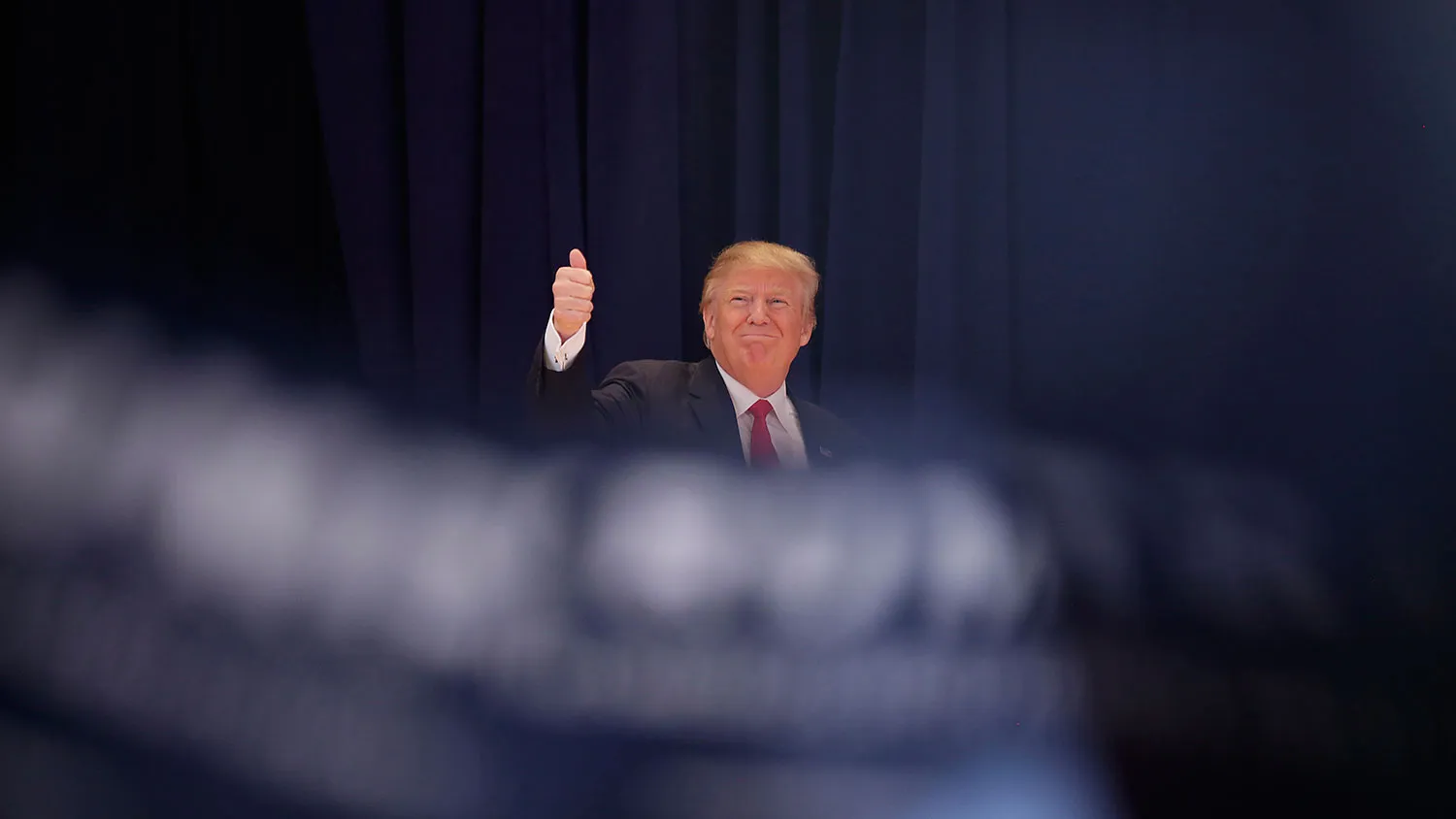 Republican presidential candidate Donald Trump gives a thumbs-up on Jan. 23, 2016, in Pella, Iowa.
