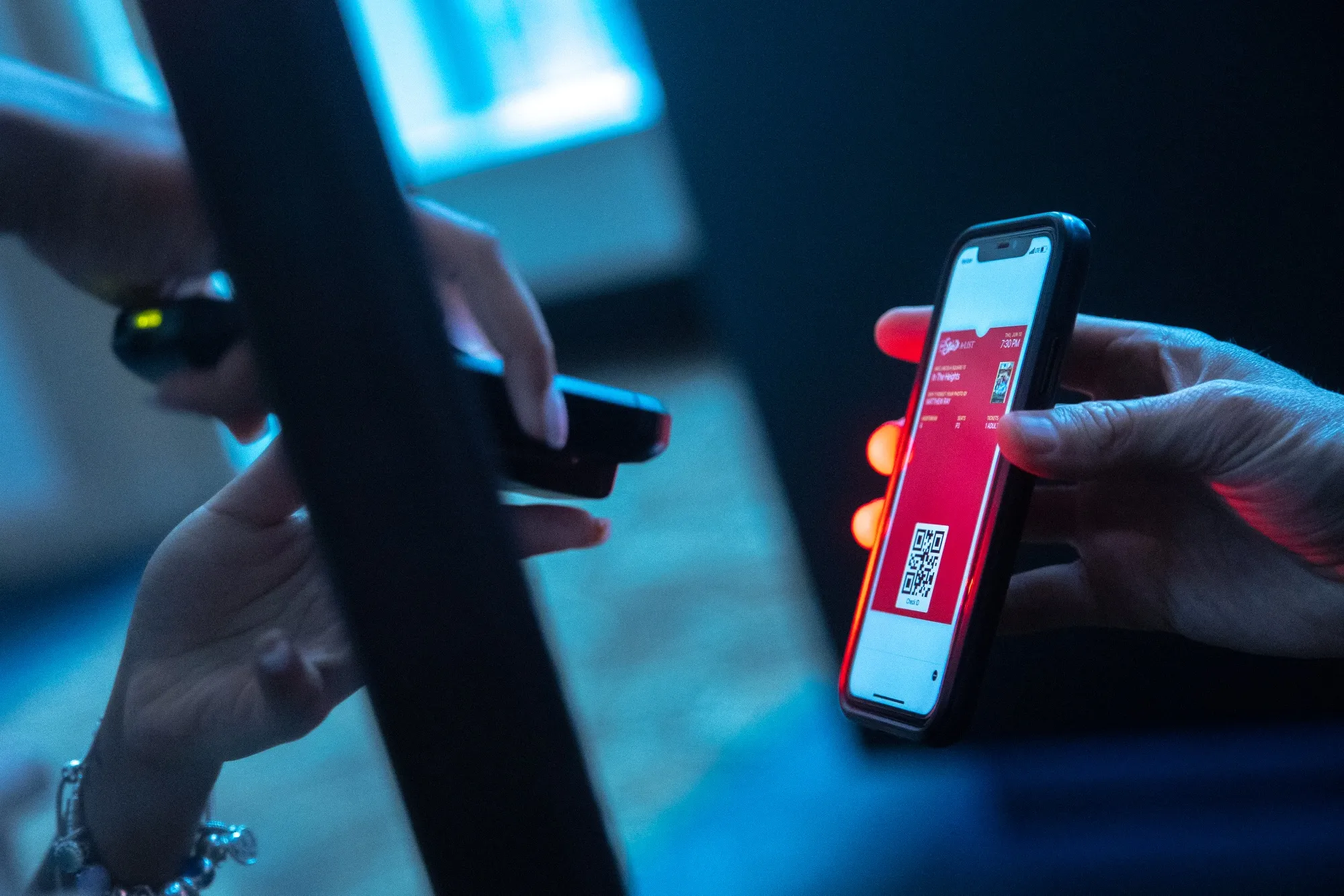 An employee scans a film ticket on a mobile device at the AMC Lincoln Square 13 movie theater in New York, U.S., on Thursday, June 10, 2021. More board members at AMC Entertainment Holdings Inc. are rushing to lock in gains from the movie-theater giant's Reddit-fueled stock surge, making another wave of sales this week.