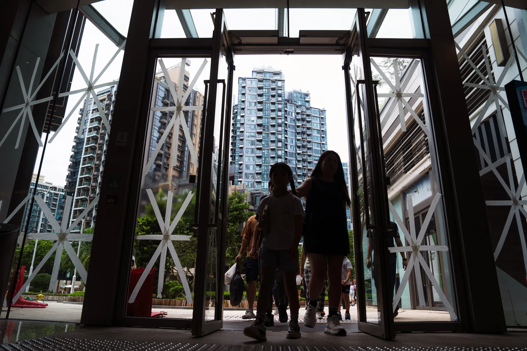Taped-up windows at a shopping center in Hong Kong ahead of Super Typhoon Ragasa.