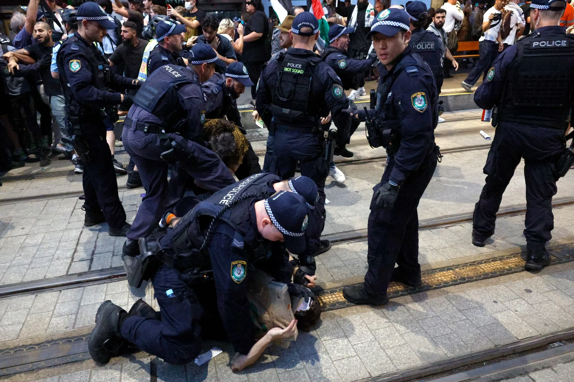 Police detain a protester during a protest against the visit of Israel's President Isaac Herzog in Sydney on Feb. 9.