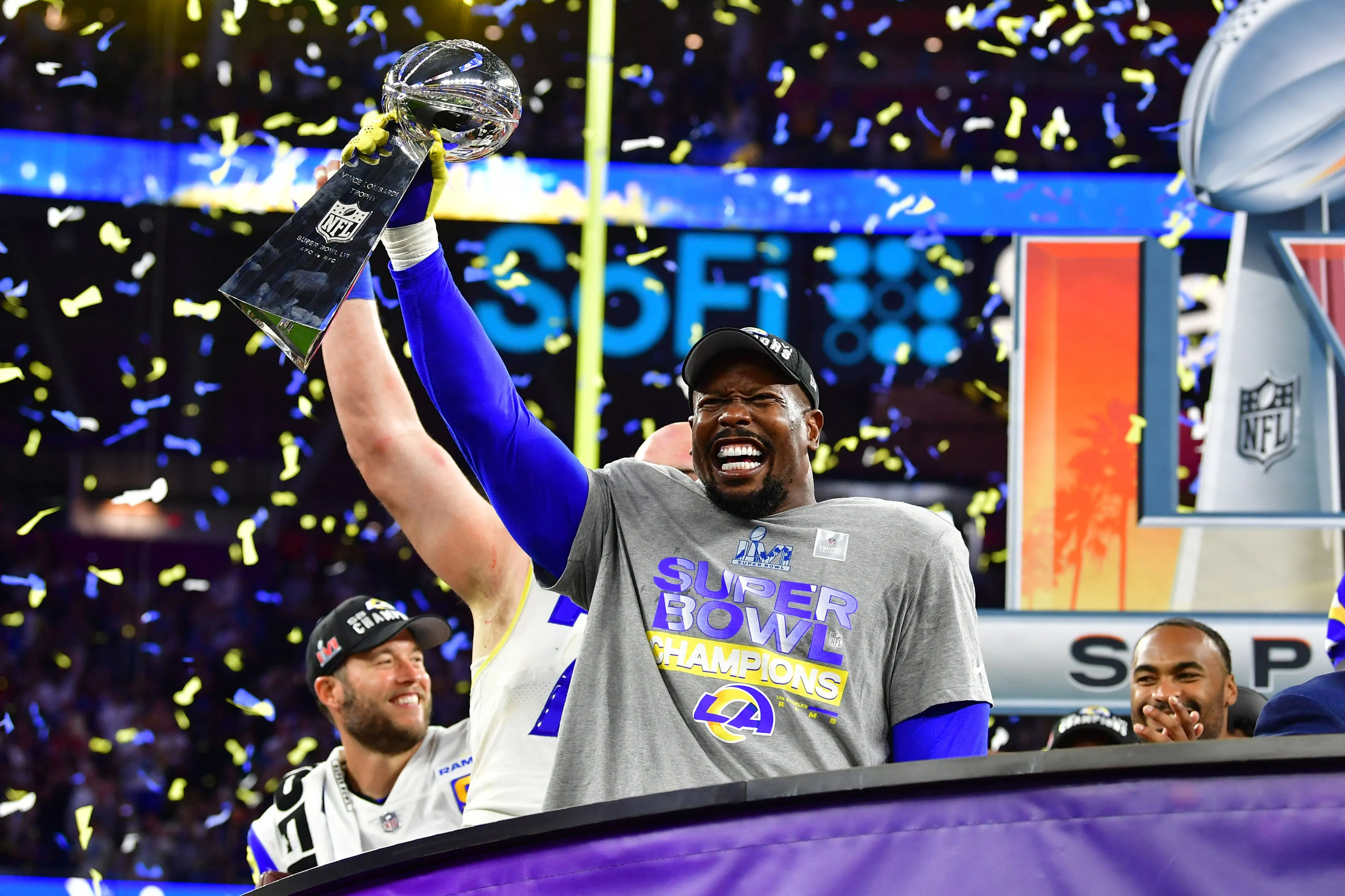 Los Angeles Rams' Von Miller holds up the trophy after winning Super Bowl LVI on Feb. 13.