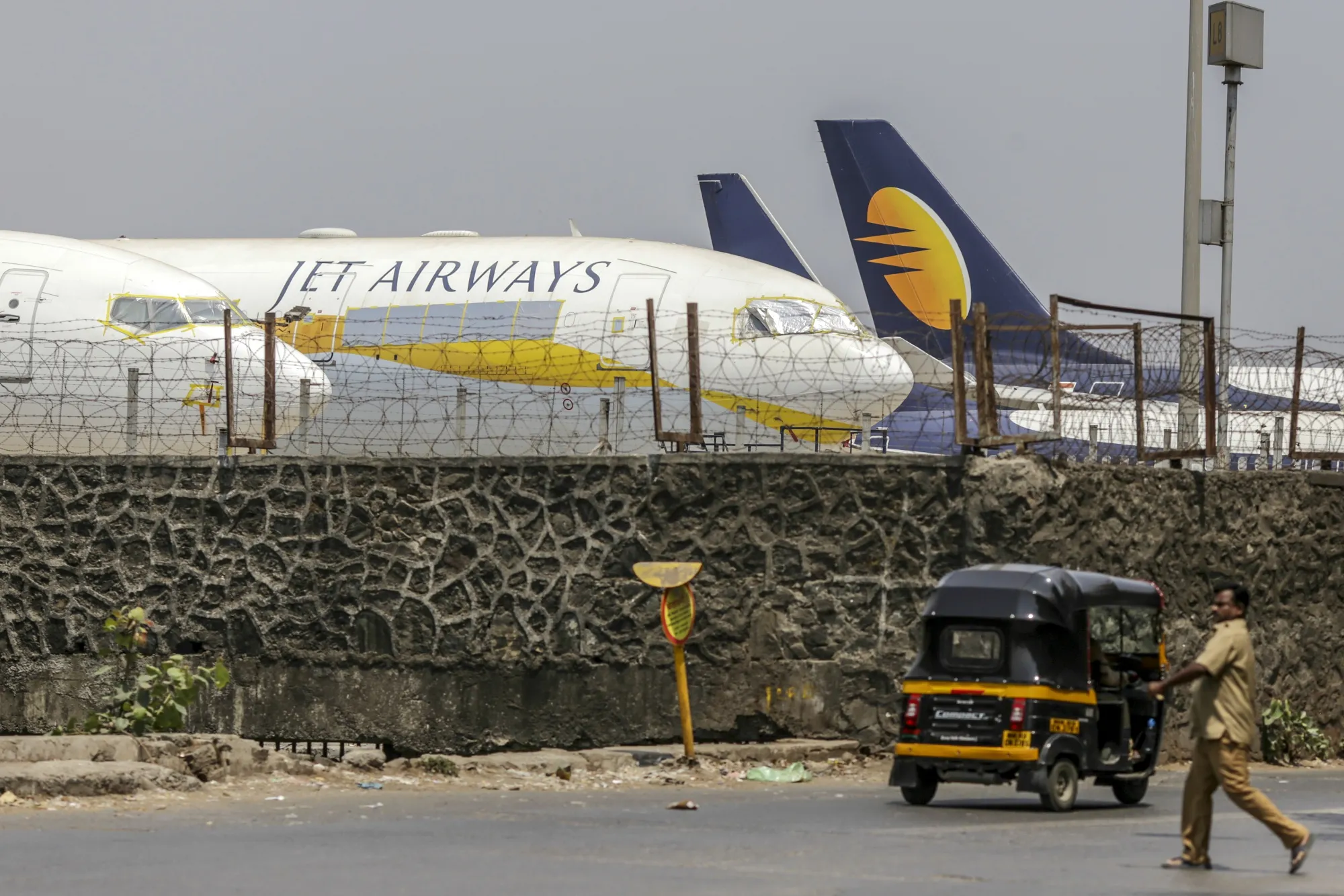 Jet Airways aircraft sit on the tarmac at Chhatrapati Shivaji Maharaj International Airport in Mumbai, India.