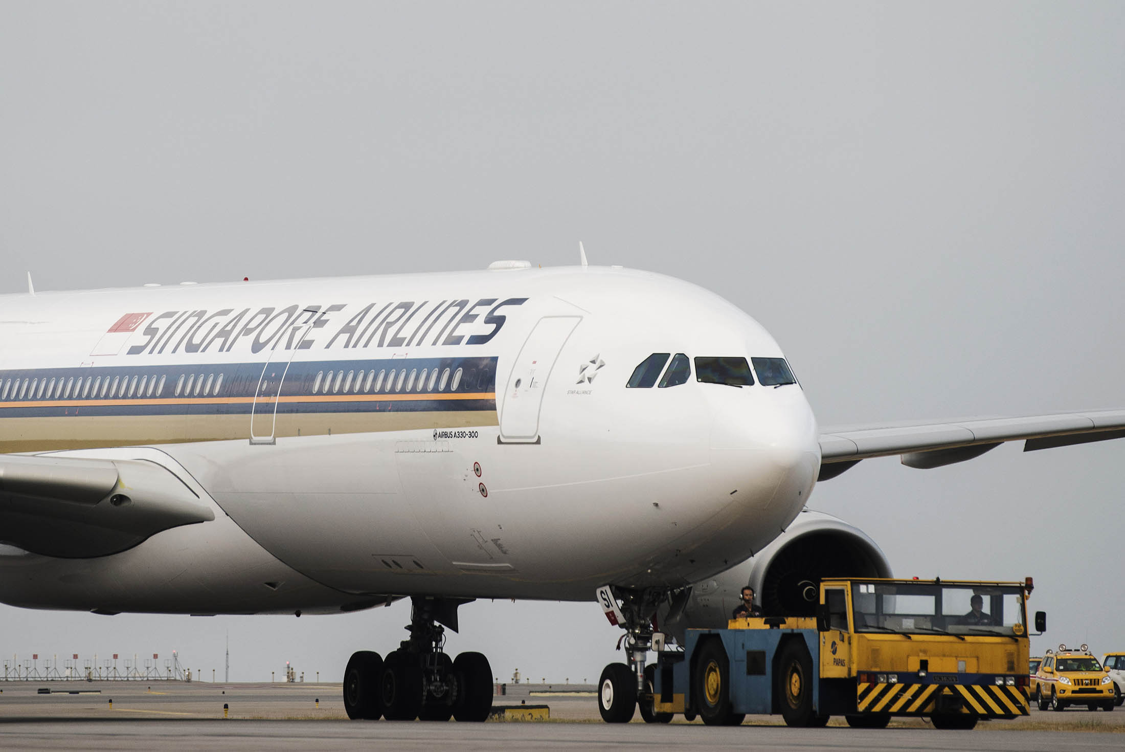 A Singapore Airlines Ltd. Airbus SAS A330-300 aircraft taxies at Hong Kong International Airport in Hong Kong, China, on Sunday, Nov. 15, 2015. The Hong Kong government in March approved a third runway at the city's international airport that would help Hong Kong compete with regional rivals seeking to benefit from growing passenger traffic and cargo demand in Asia, particularly China.
