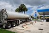 A fuel tanker delivers fuel at a Chevron gas station in Miami, Florida. 