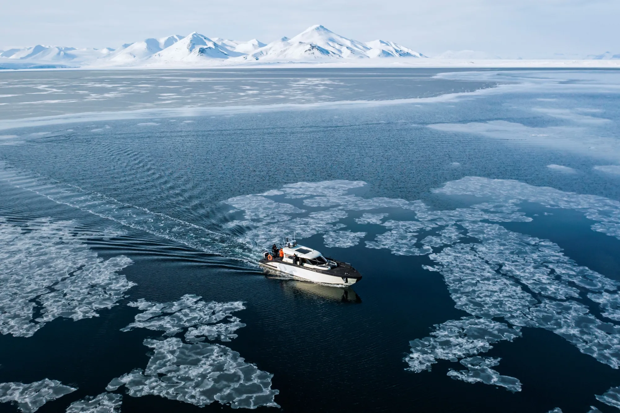 The Kvitbjorn (Polar Bear, in Norwegian) boat as it makes its way in the sea ice in the Borebukta Bay, located at the northwestern side of Isfjorden, in Svalbard Archipelago, northern Norway.