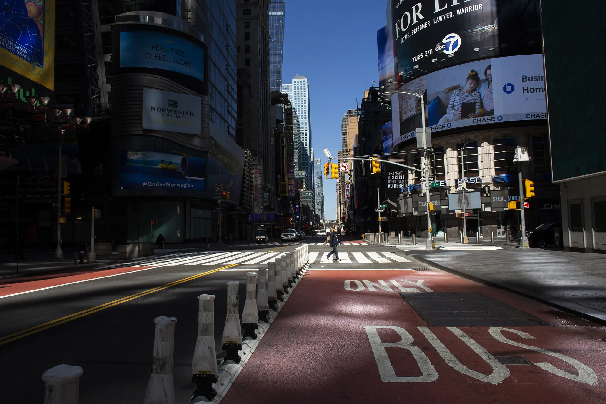 &nbsp;A person crosses&nbsp;Times Square in New York on April 6.