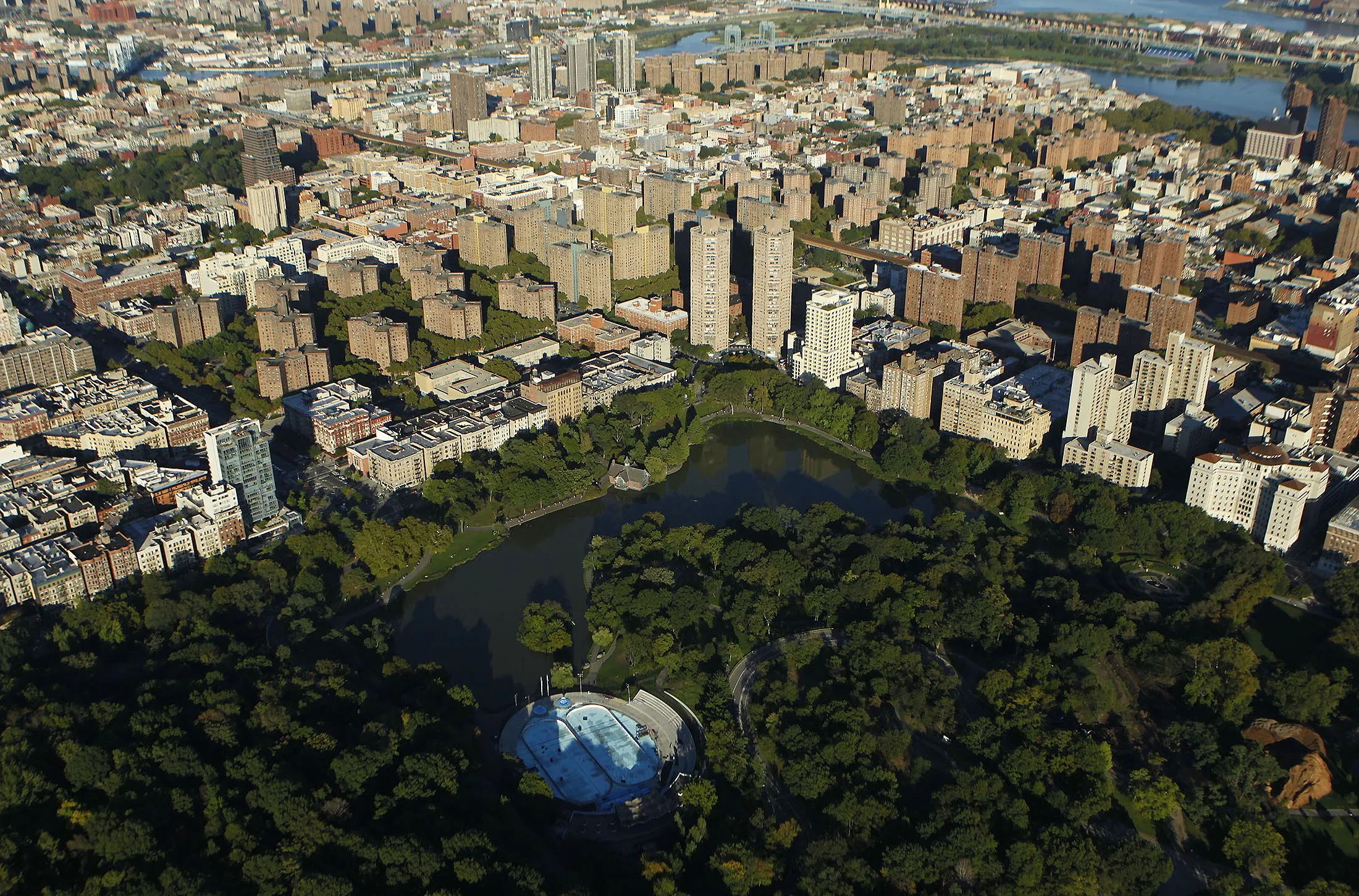 Central Park stands next to the Harlem neighborhood of Manhattan in this aerial photograph taken over New York, U.S., on Saturday, Oct. 2, 2010. New York City sold $775 million in Build America Bonds as international buyers purchased about 16 percent of the debt, the most in the city's history.
