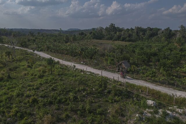 A motorcycle travels down a gravel road near Lázaro Cárdenas 2 in Campeche state , Mexico, on Saturday, May. 7, 2022. 