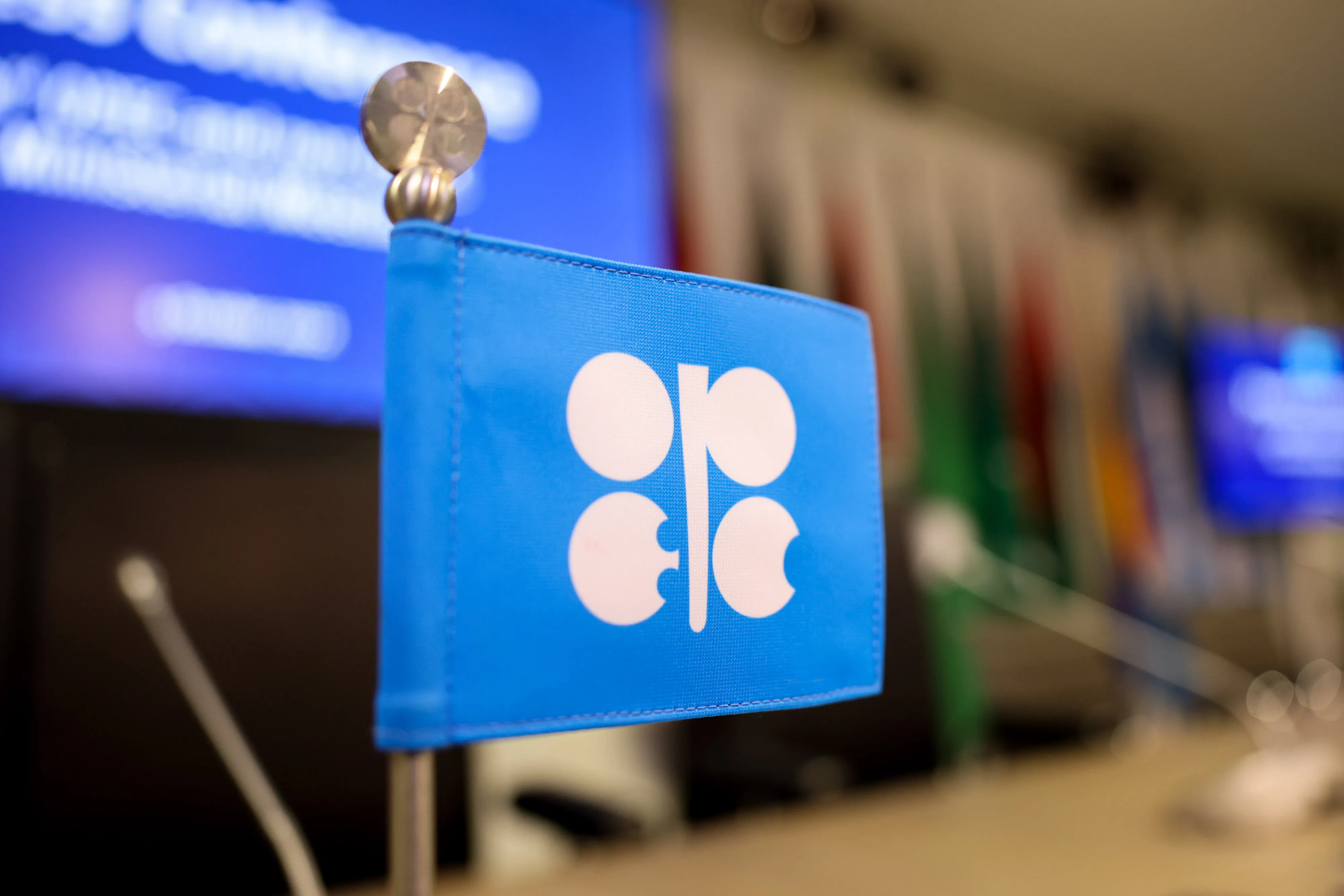 A&nbsp;flag sits on a delegate desk at the OPEC+ meeting in Vienna.