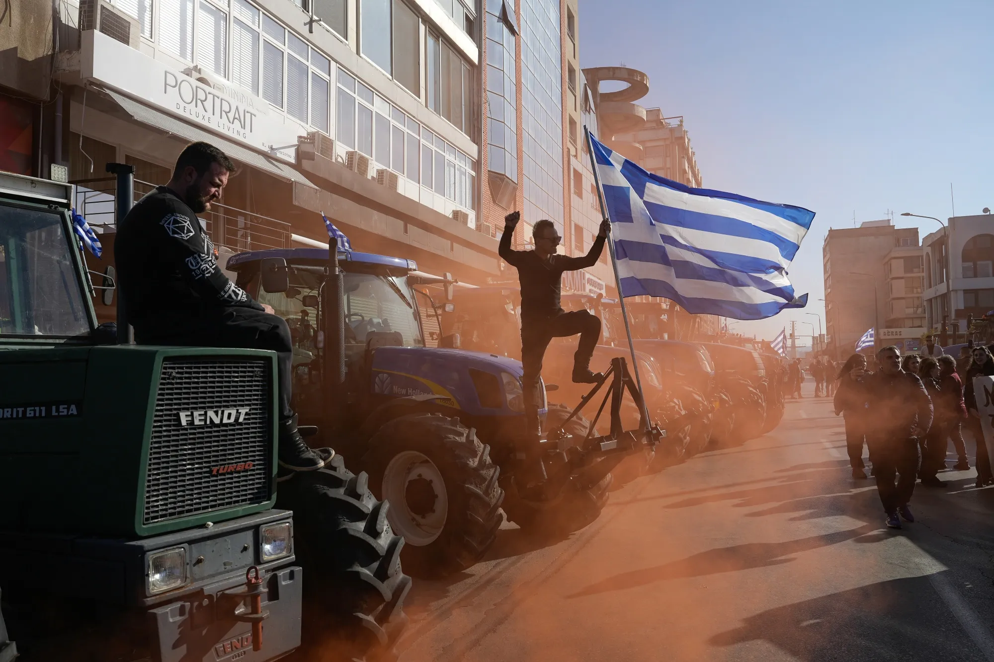Greek farmers protest during a demonstration in front of the main gate of the passenger terminal at Thessaloniki port in Thessaloniki, Greece, on Dec. 12, 2025.