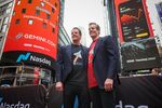 Tyler Winklevoss, chief executive officer and co-founder of Gemini Space Station Inc., left, and Cameron Winklevoss, president and co-founder of Gemini Space Station Inc., right, during the company's initial public offering (IPO) at the Nasdaq MarketSite in New York, US, on Friday, Sept. 12, 2025. Gemini Space Station Inc. raised $425 million in an initial public offering, pricing its stock above a marketed range and shrinking the number of shares.