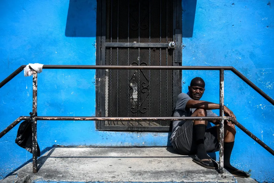 A 59-year-old man named Al sits outside his house in a low-income neighborhood in Miami in April. He lost his job in March due to the coronavirus pandemic and, like many other tenants in the U.S., has not been able to pay his rent since.