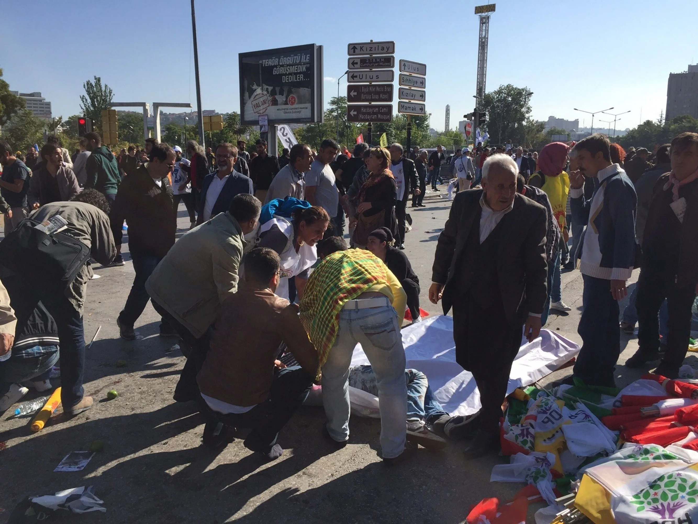 People gather at the site of an explosion close to Ankara's main train station on October 10, 2015 in Ankara, Turkey.
