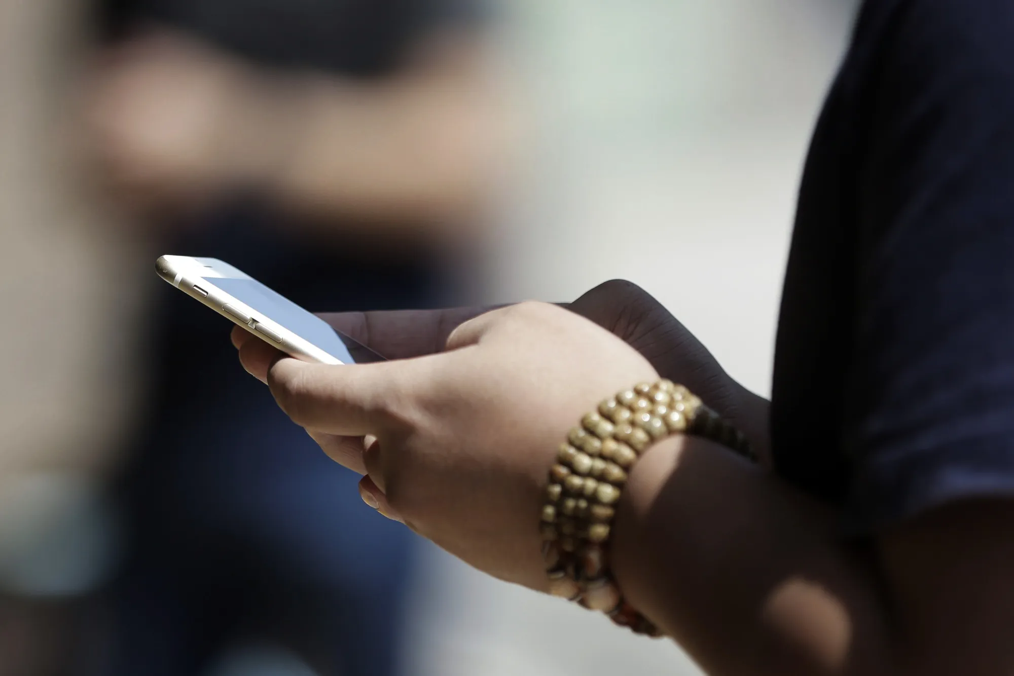 Mobile Phone Users And Stores As NTT DoCoMo Inc. Leads Plunge After Abe Calls For Lower Phone Bills