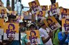 Members of the Council of Popular and Indigenous Organizations of Honduras (COPINH) hold posters with an image of slain indigenous leader and environmental activist Berta Cáceres at a demonstration in Tegucigalpa, Honduras, on Oct. 10, 2019.