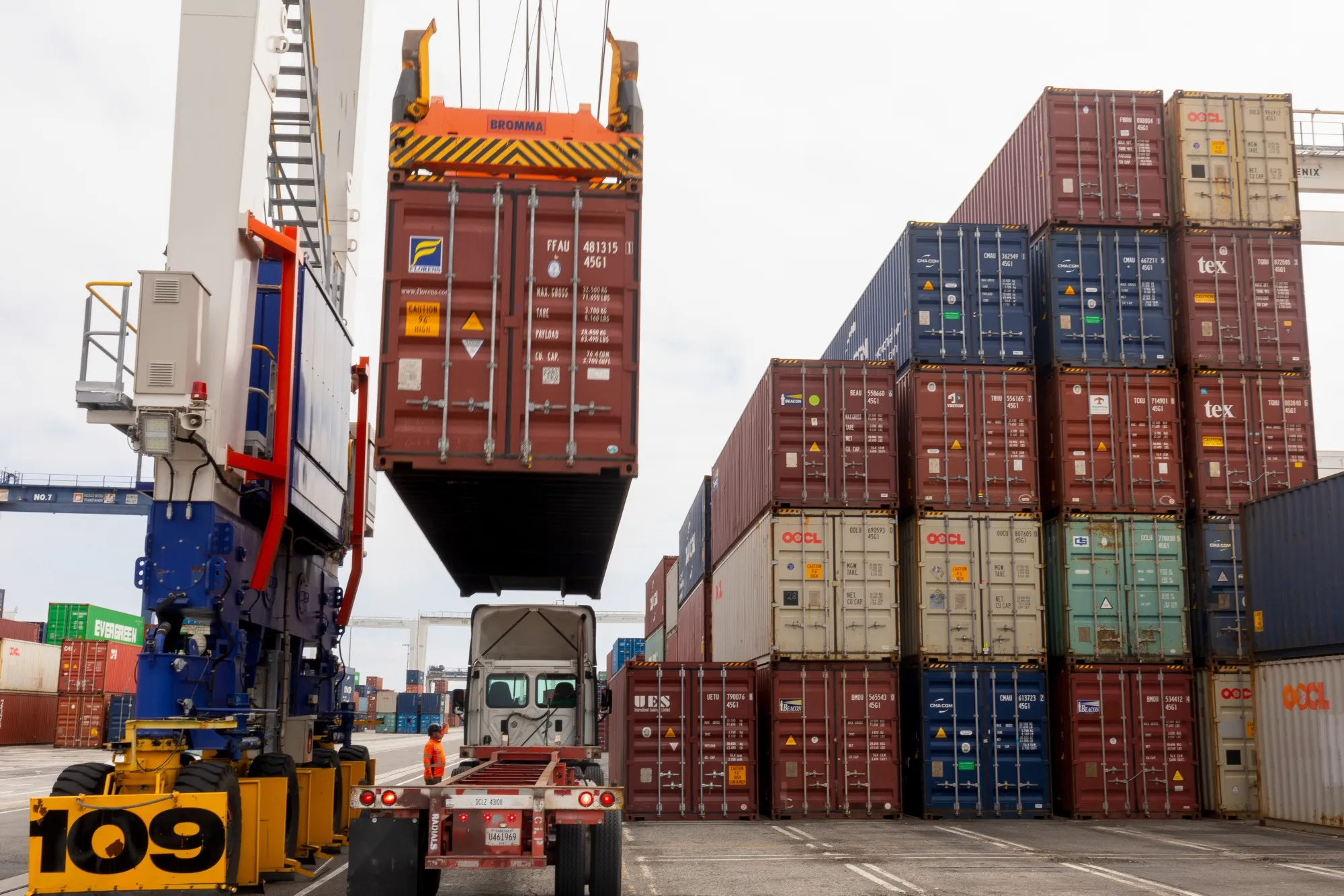 A portainer crane moves containers at the Port of Los Angeles.