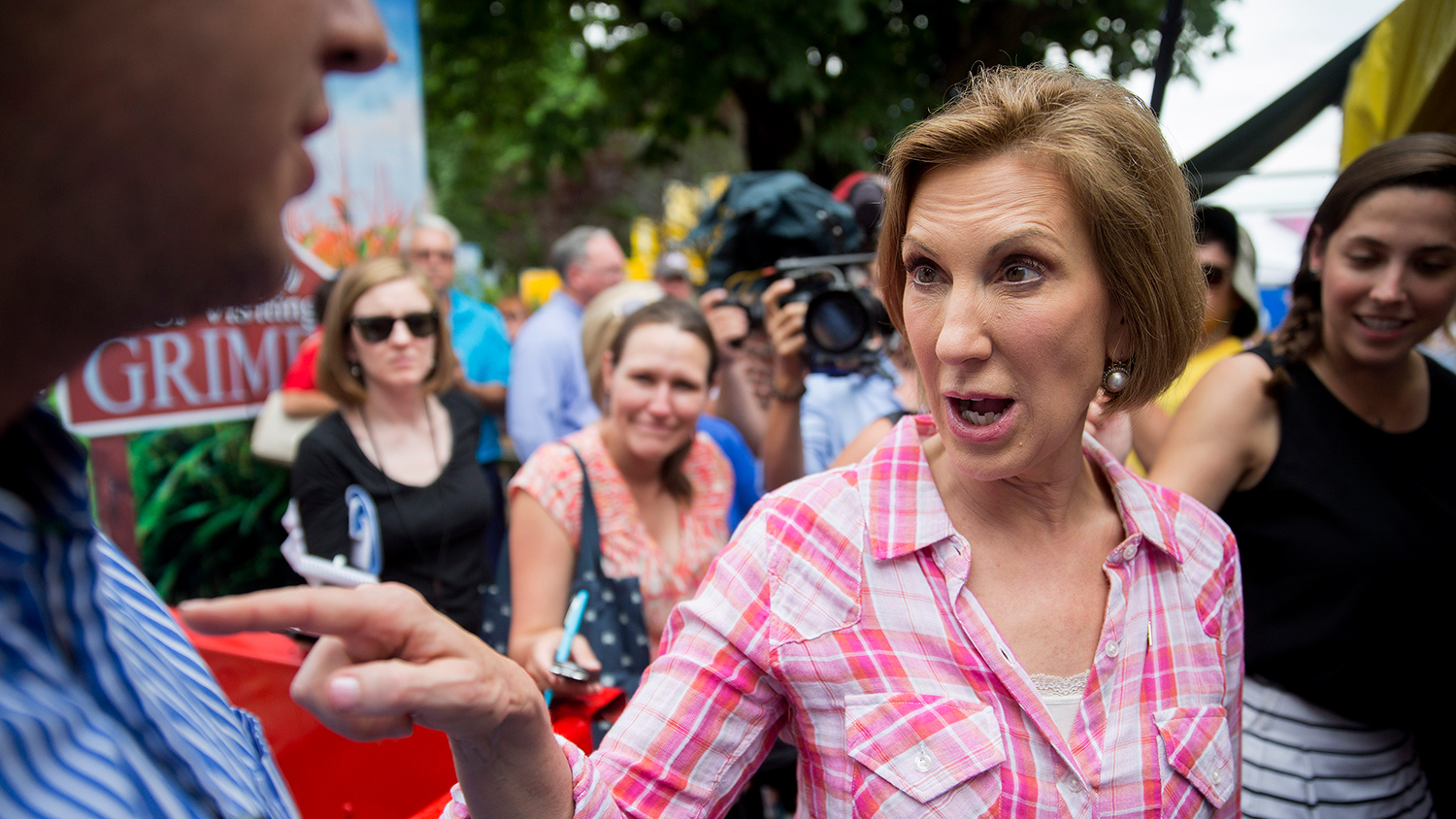 Carly Fiorina, former chairman and chief executive officer of Hewlett-Packard Co. and 2016 Republican presidential candidate, speaks with an attendee while touring the Iowa State Fair in Des Moines, Iowa, U.S., on Monday, Aug. 17, 2015.
