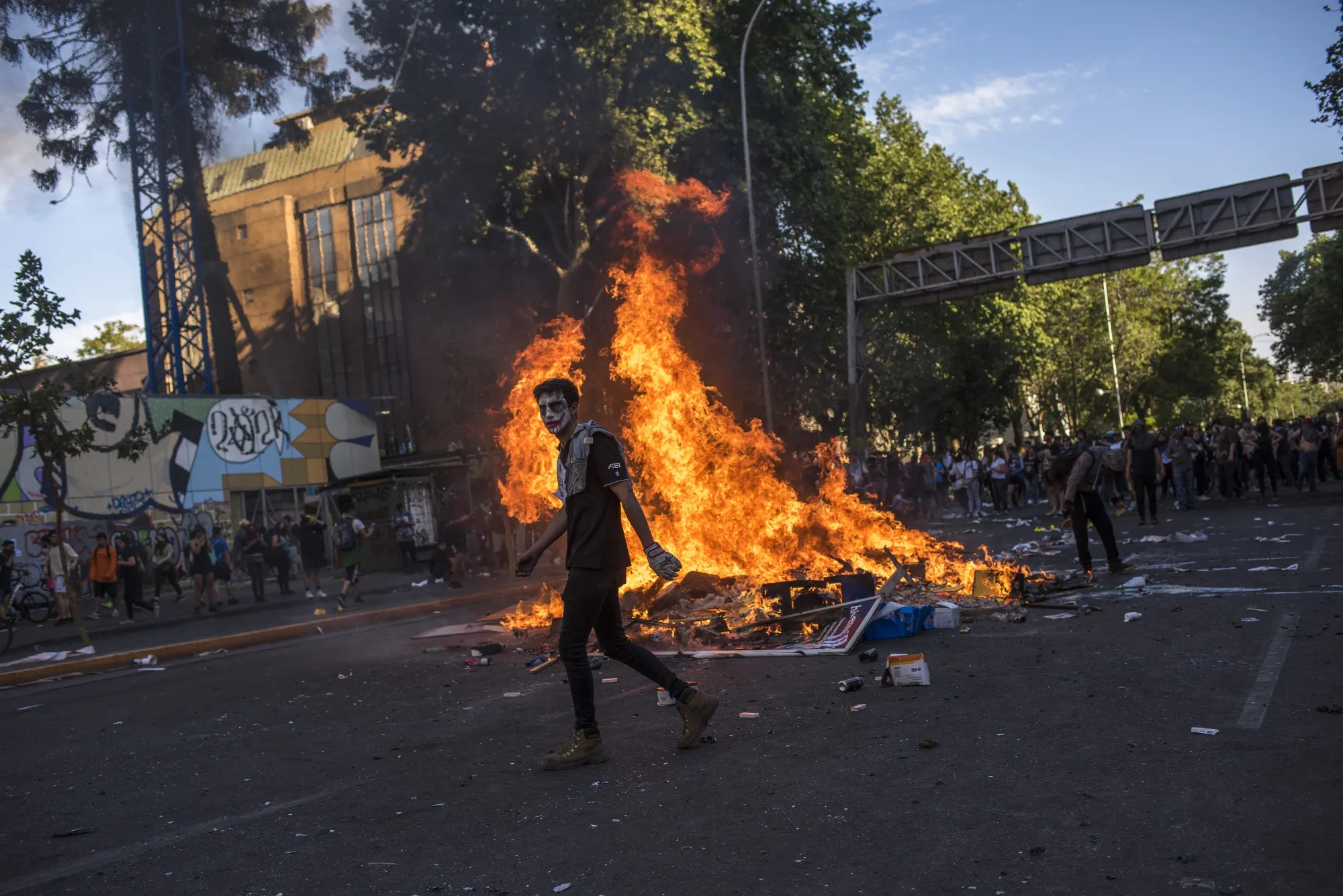 Fire burns on a street during a protest in Santiago, Chile, on&nbsp;Oct. 21.